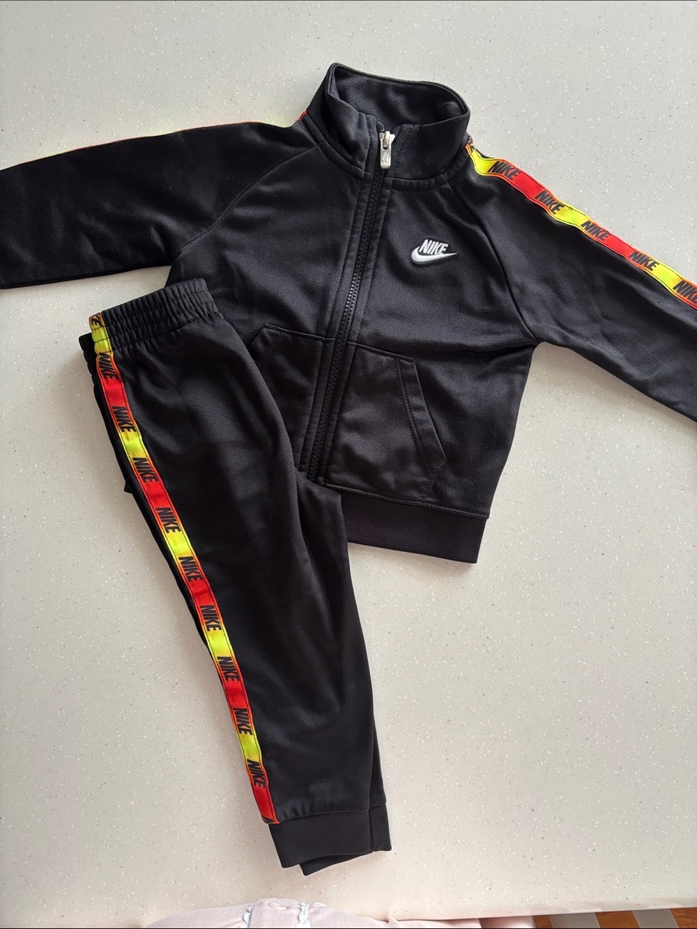 Nike Black Kids Track Set with Red and Yellow Stripe